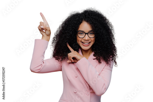 Tableau sur toile Half length shot of cheerful Afro American woman with dark bushy hairstyle, wear