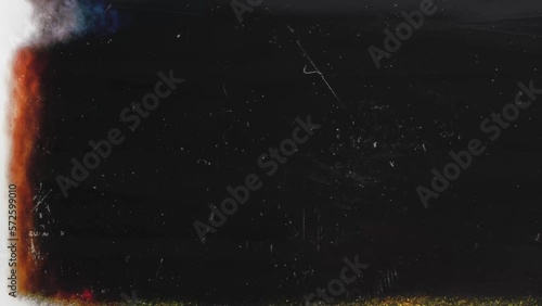 dust 35mm film transition, vintage film burn overlay on black background. film noise or grain.