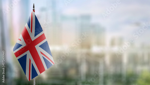 Small flags of the United Kingdom on an abstract blurry background photo