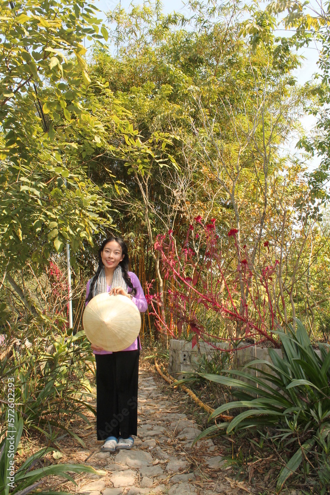 vietnam beutiful woman with ba ba shirt especially in the Mekong Delta and water lilies flower vietnam beutiful woman with ba ba shirt especially in the Mekong Delta and water lilies flower