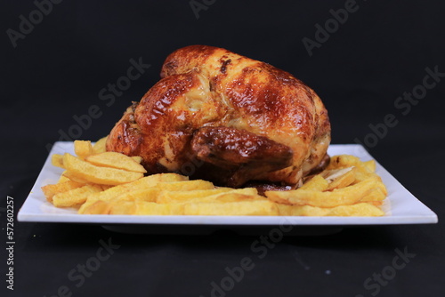 Grilled Chicken and French Fries Served on Plate Isolated on Black background | Premium Food Images