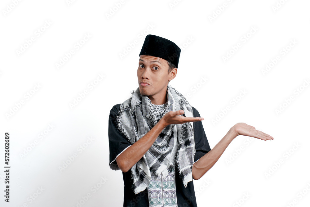 Religious muslim asian man wearing turban, muslim dress and cap, pointing to the side of empty space. Isolated on white background. Religious muslim asian man wearing turban, muslim dress and cap, pointing to the side of empty space. Isolated on white background.