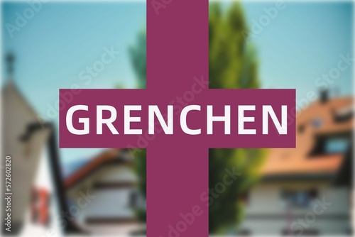 Grenchen: Der Name der schweizer Stadt Grenchen im Kanton Solothurn vor einem Hintergrundbild