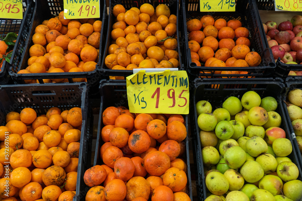 Fruit stand in the supermarket. with apples, tangerines, oranges and clementines. With signs indicating the price. Fruit stand in the supermarket. with apples, tangerines, oranges and clementines. With signs indicating the price.
