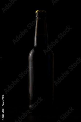 A bottle of beer on a black background