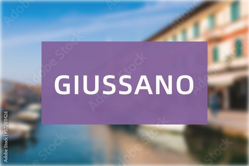 Giussano: Der Name der italienischen Stadt Giussano in der Region Lombardy vor einem Hintergrundbild photo