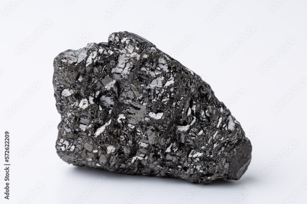 Natural black fossil coal on a white isolated background. Natural black fossil coal on a white isolated background.