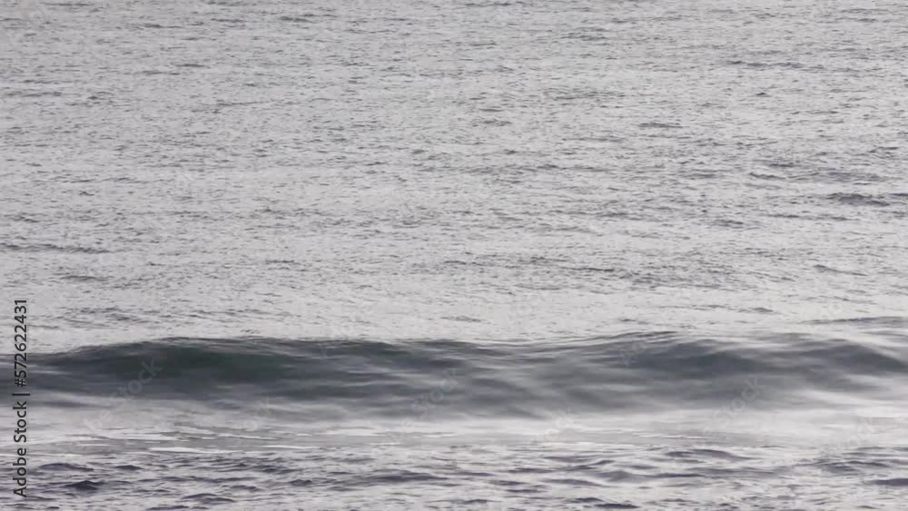 Surfer Waiting for Waves and Boat Going Past, Wide Shot Surfer Waiting for Waves and Boat Going Past, Wide Shot
