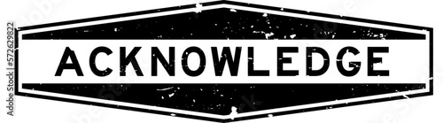 Grunge black acknowledge word hexagon rubber seal stamp on white background