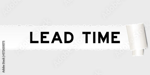 Ripped gray paper background that have word lead time under torn part