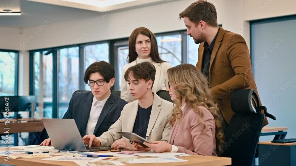 Business meeting in an office, workers discussing business affairs using gadgets and papers. Slow motion Business meeting in an office, workers discussing business affairs using gadgets and papers. Slow motion