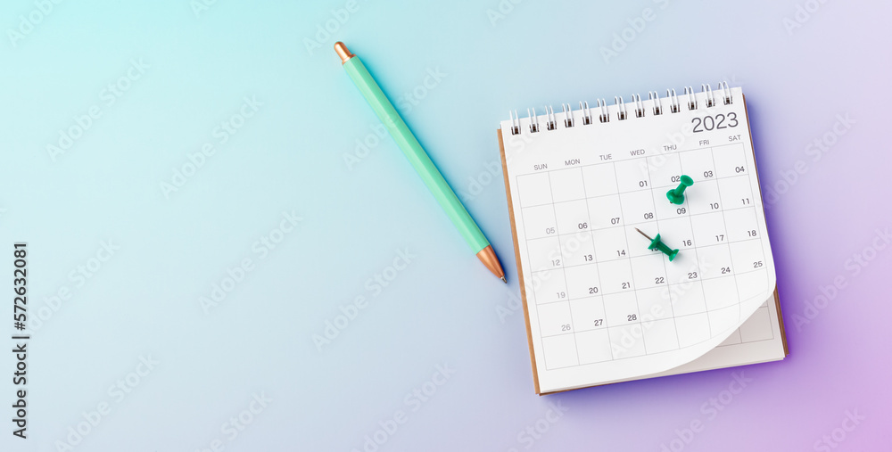 Calendar 2023 with pinned date and pen on pastel gradient background Calendar 2023 with pinned date and pen on pastel gradient background
