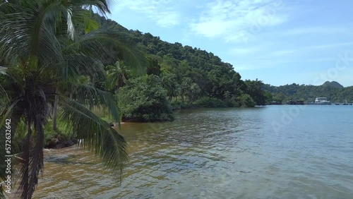 Amazing aerial view flight 
natural sand beach Koh chang island Thailand sunny day 2022. High Quality 4k Cinematic footage.
very close passing flight drone