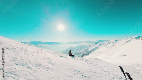 Low Fly over the seated FPV pilot wearing the DJI mask and revealing the landscape in the French Alps