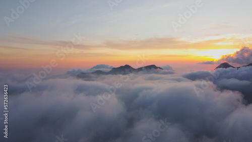 aerial photo above the clouds view of the sky at dusk