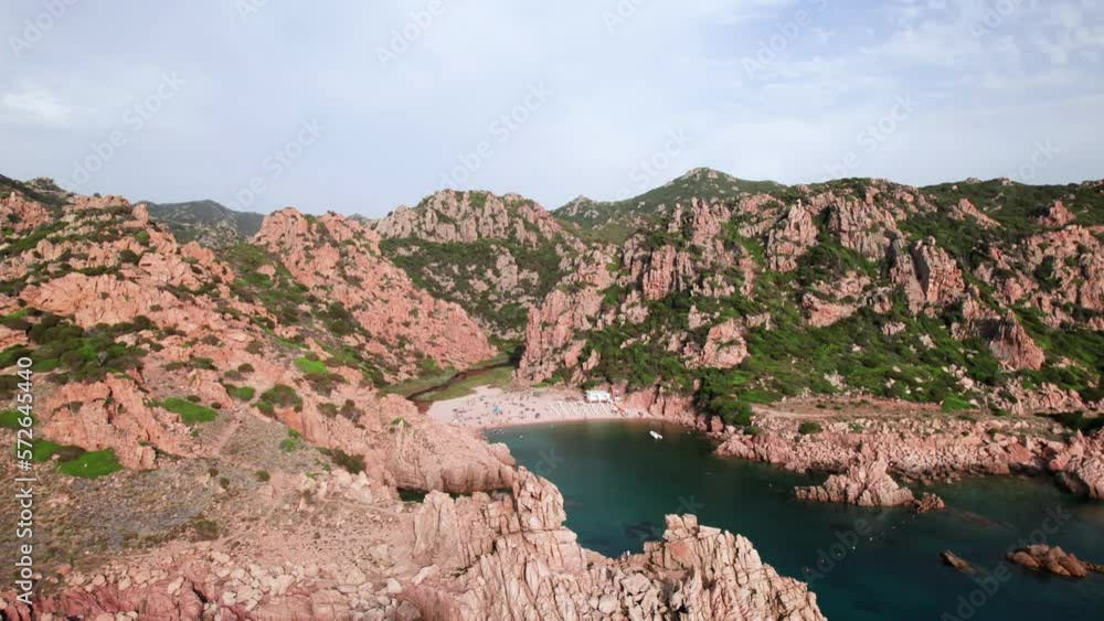 Aerial wide panorama of white sand beach in a rocky bay on Sardinia coast Aerial wide panorama of white sand beach in a rocky bay on Sardinia coast