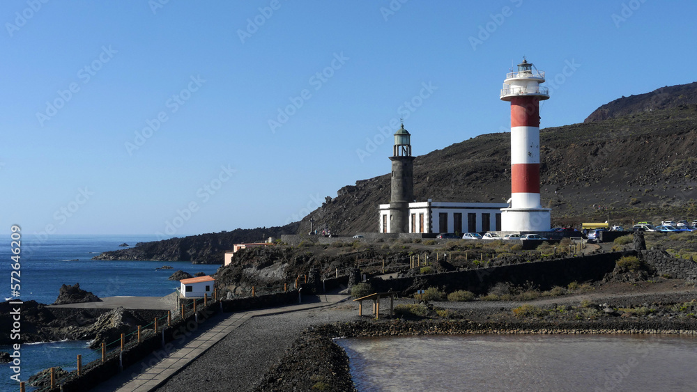 Sea Salt production, La Palma. The lighthouse ant Fuencaliente see over a salt pan Sea Salt production, La Palma. The lighthouse ant Fuencaliente see over a salt pan