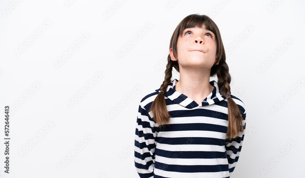 Little caucasian girl isolated on white background and looking up Little caucasian girl isolated on white background and looking up
