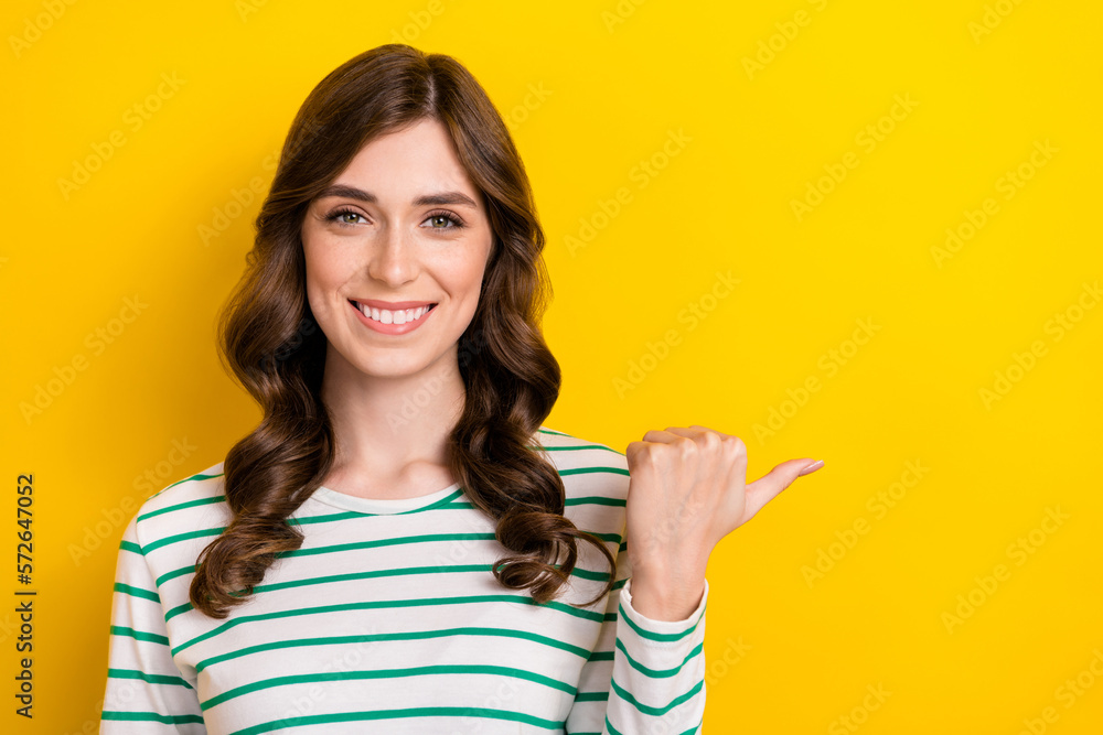 Portrait of confident attractive woman brown wavy hair wear white shirt direct thumb empty space language courses isolated on yellow color background Portrait of confident attractive woman brown wavy hair wear white shirt direct thumb empty space language courses isolated on yellow color background