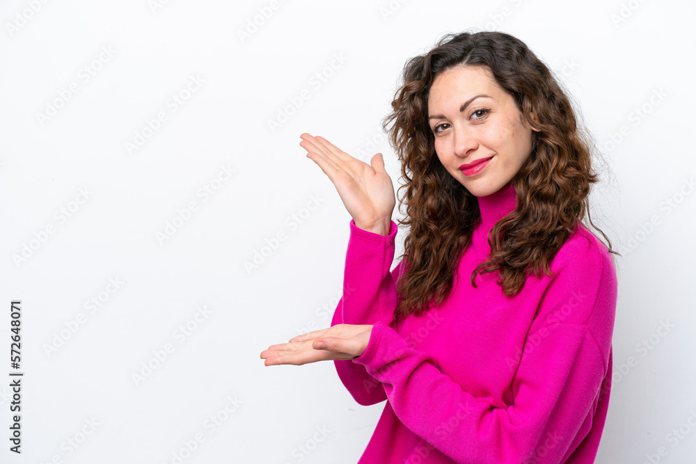 Young caucasian woman isolated on white background extending hands to the side for inviting to come Young caucasian woman isolated on white background extending hands to the side for inviting to come