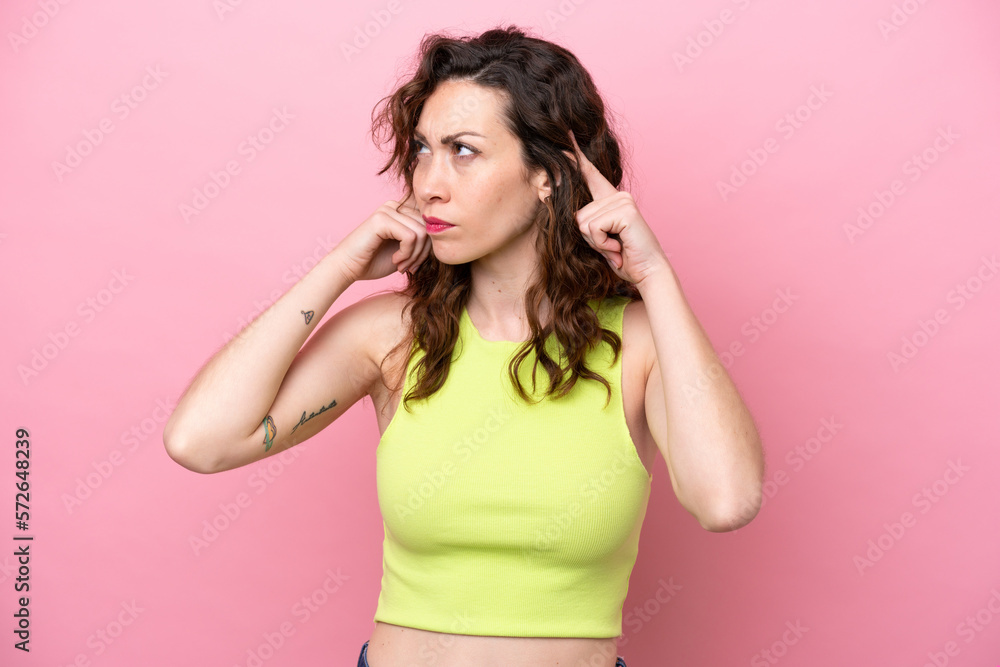 Young caucasian woman isolated on pink background having doubts and thinking Young caucasian woman isolated on pink background having doubts and thinking