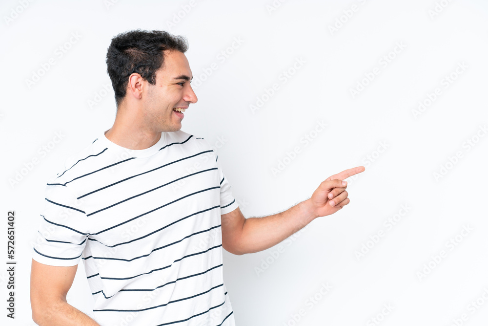 Young caucasian man isolated on white background pointing finger to the side and presenting a product Young caucasian man isolated on white background pointing finger to the side and presenting a product