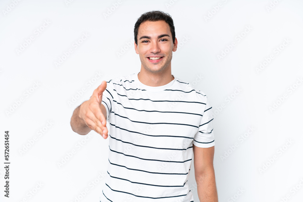 Young caucasian man isolated on white background shaking hands for closing a good deal Young caucasian man isolated on white background shaking hands for closing a good deal