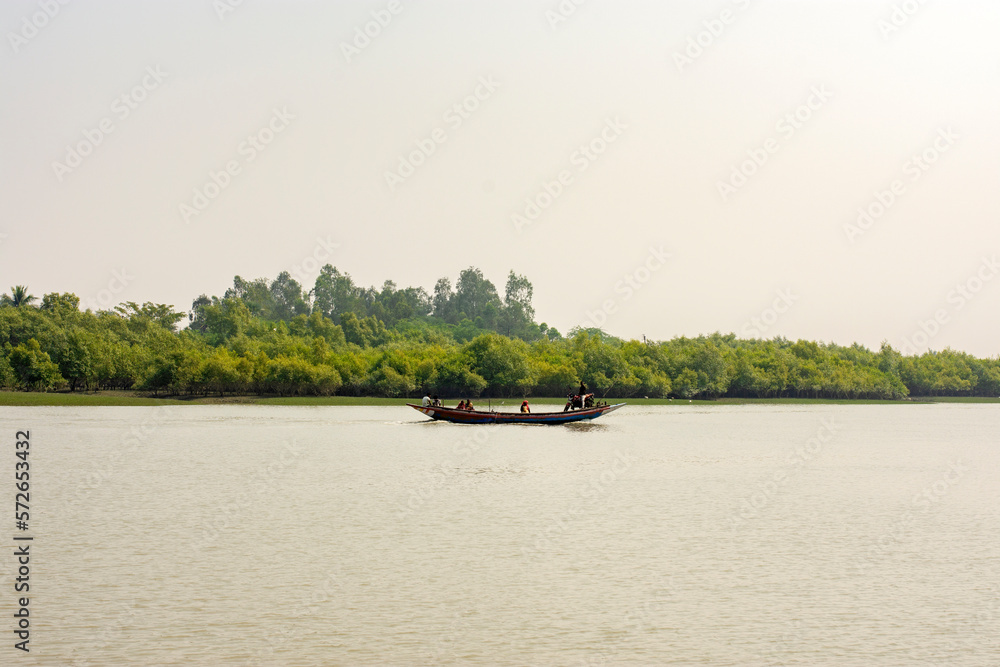 11th February, 2023, Sundarban, West Bengal, India: A fisher man family going for fishing with their country boat at Sundarban Tiger Reserve.