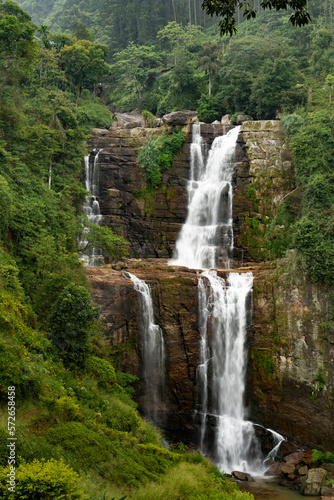 beautiful waterfall among the tea plantations of sri lanka