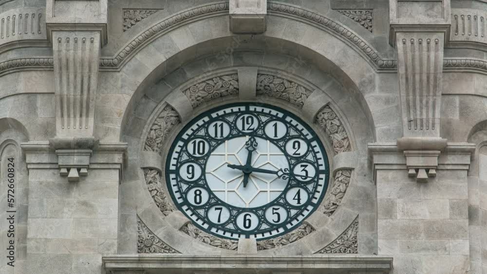 Watch on City Hall building timelapse Camara Municipal do Porto on Liberdade Square, Porto, Portugal. Close up vie to watchface showing time Watch on City Hall building timelapse Camara Municipal do Porto on Liberdade Square, Porto, Portugal. Close up vie to watchface showing time