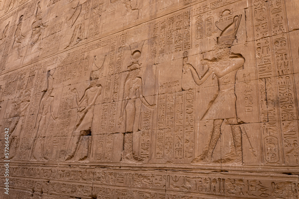 Edfu Horus Temple Walls Decorated with Reliefs of Ancient Egyptian Gods. Ptolemaic Temple of Horus, Edfu near Aswan, Egypt. Africa. Edfu Horus Temple Walls Decorated with Reliefs of Ancient Egyptian Gods. Ptolemaic Temple of Horus, Edfu near Aswan, Egypt. Africa.