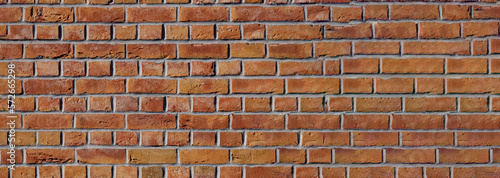 Old red brick wall background, wide panorama. Masonry wall, stonework