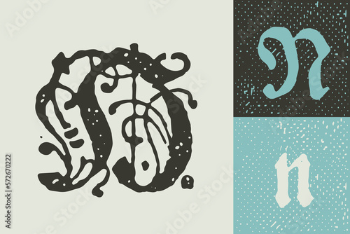 N letter drop cap logo. Illuminated initial and blackletter uppercase and lowercase.