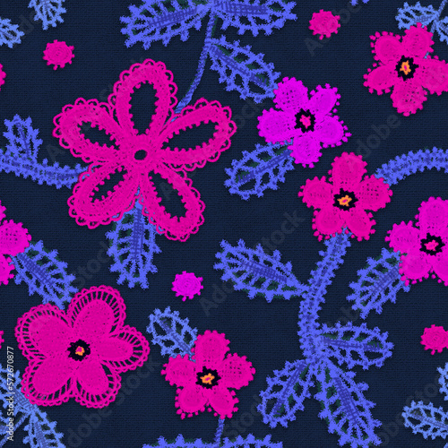 Seamless background with embroidery. Fabric with vivid abstract flowers.