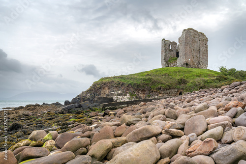 The remains of Minard Castle from Minard Beach, County Kerry, Ireland photo