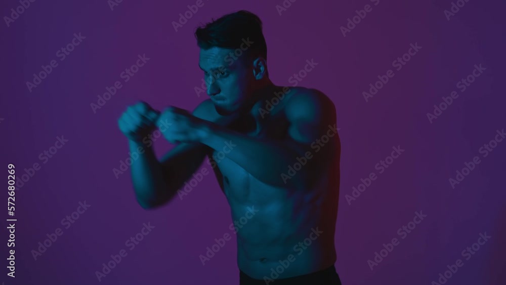 Young athlete training in the gym. Muscular man making workout and exercises. Studio lighting and cinematic look styled concept about sport and healhty lifestyle. Young athlete training in the gym. Muscular man making workout and exercises. Studio lighting and cinematic look styled concept about sport and healhty lifestyle.