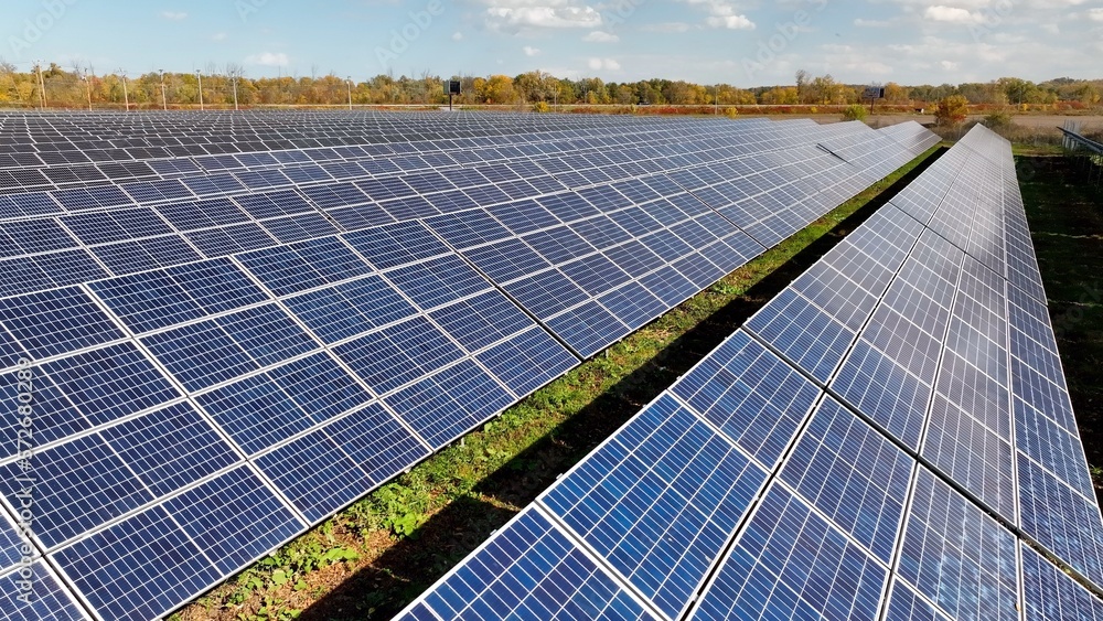 Solar panels on rural farmland in countryside generating sustainable energy and electric power for America homes and business Solar panels on rural farmland in countryside generating sustainable energy and electric power for America homes and business