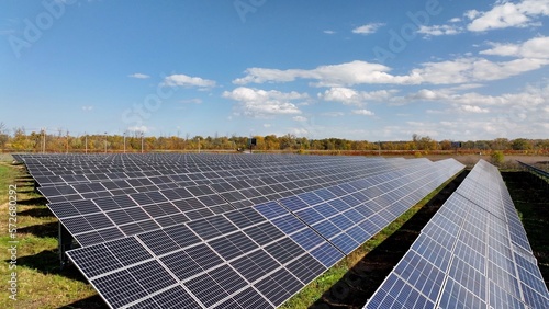 Solar panels on rural farmland in countryside generating sustainable energy and electric power for America homes and business