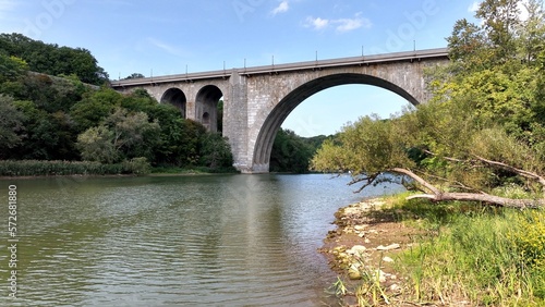 Beautiful stone bridge with arches over river Veterans Memorial Bridge in Rochester New York 