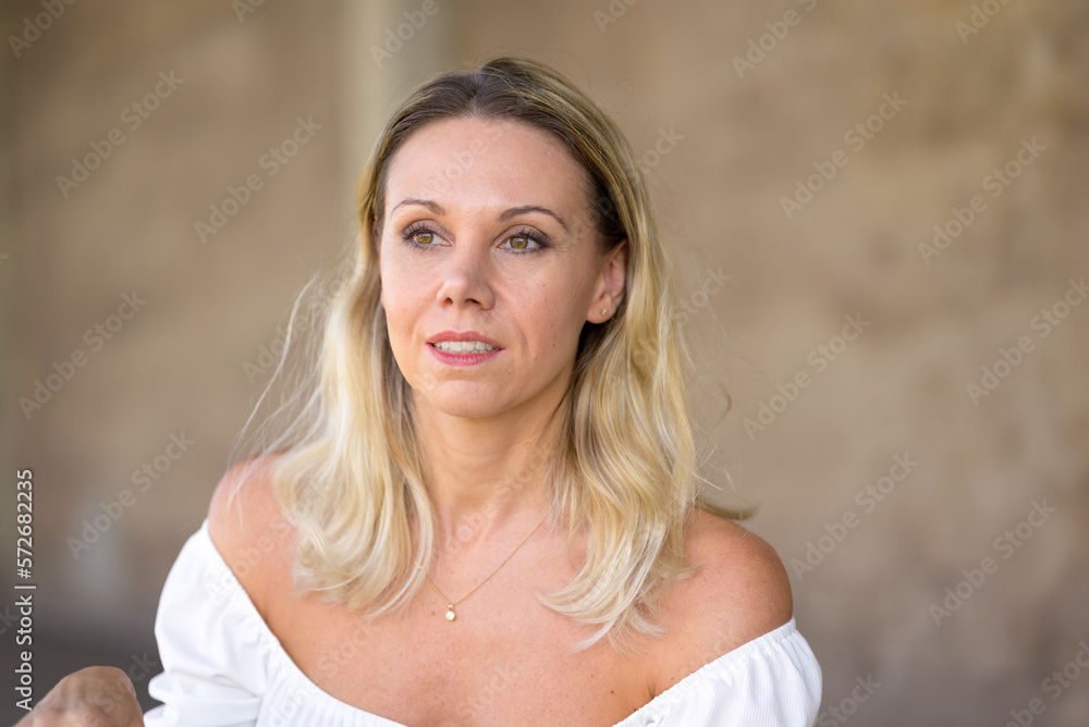 Sideways portrait of a middle-aged blonde woman Sideways portrait of a middle-aged blonde woman