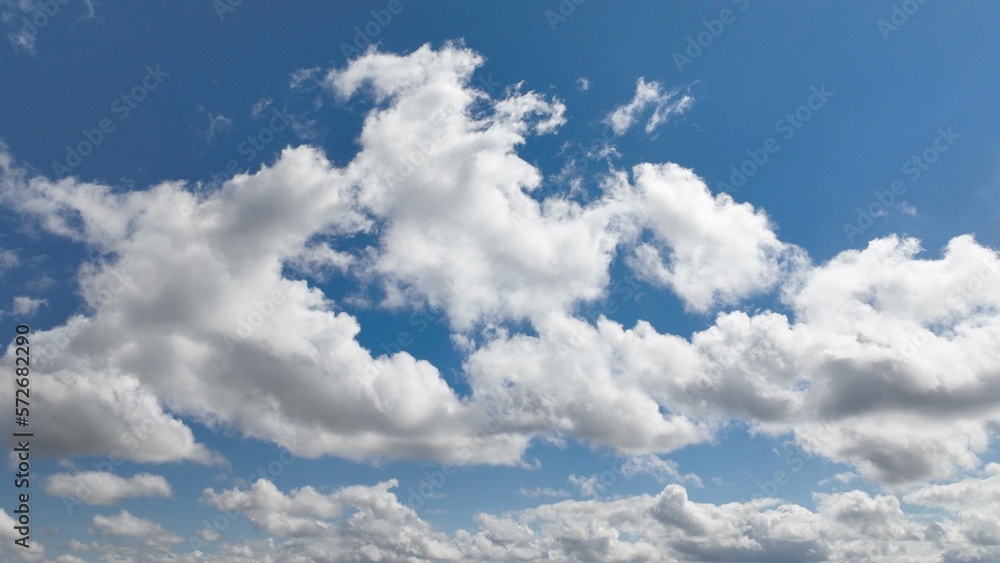 Beautiful puffy clouds in blue sky with sunshine Beautiful puffy clouds in blue sky with sunshine