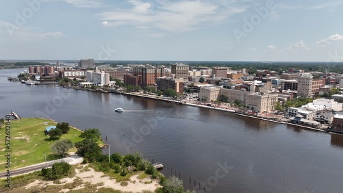 Wilmington, NC big city skyline beside water with office buildings with workers in inner city architecture
 photo