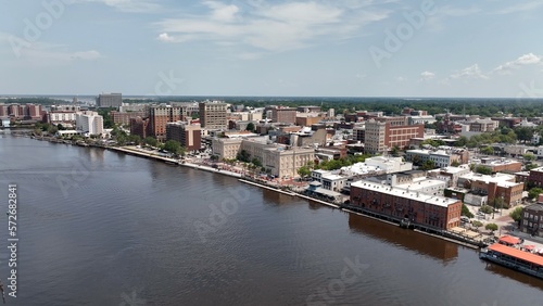 Wilmington, NC big city skyline beside water with office buildings with workers in inner city architecture 