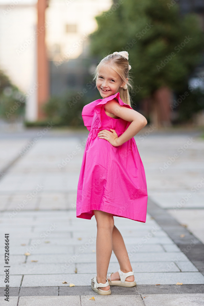 Candid portrait of cute little Caucasians blue-eyed girl with blonde hair looking at camera feel excited overjoyed with happy childhood, positive little child kid pose, children happiness concept Candid portrait of cute little Caucasians blue-eyed girl with blonde hair looking at camera feel excited overjoyed with happy childhood, positive little child kid pose, children happiness concept