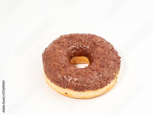Chocolate donut with chocolate chips on a white background. close-up.