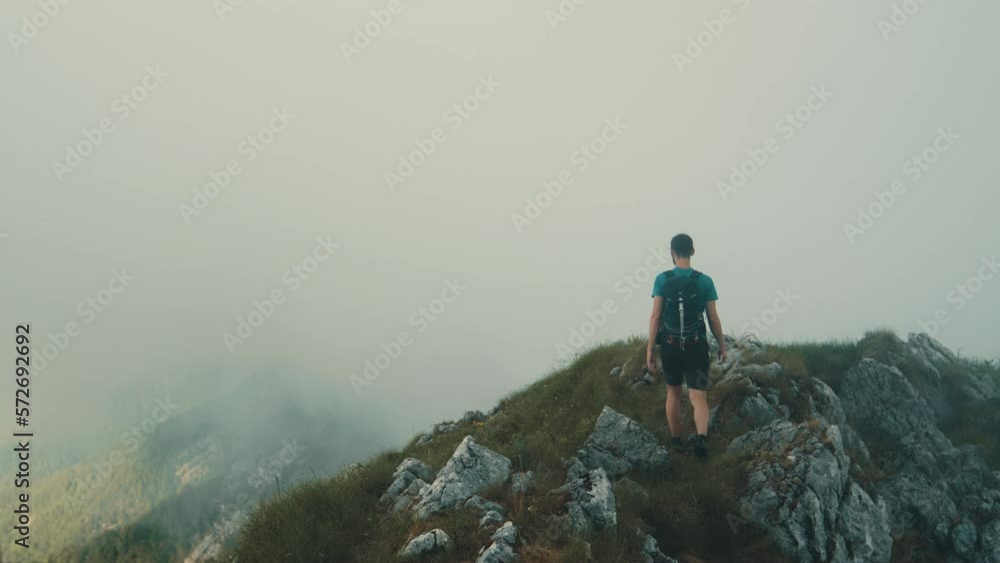 Hiker on the crest of the mountains Hiker on the crest of the mountains