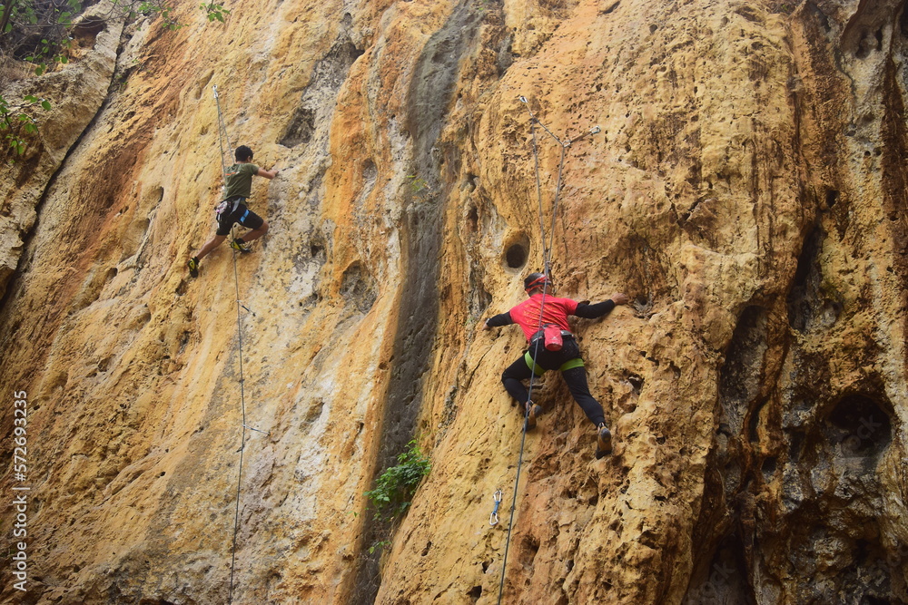 Rock climbing at Goa Pawon cliff in Bandung, West Java, Indonesia Rock climbing at Goa Pawon cliff in Bandung, West Java, Indonesia