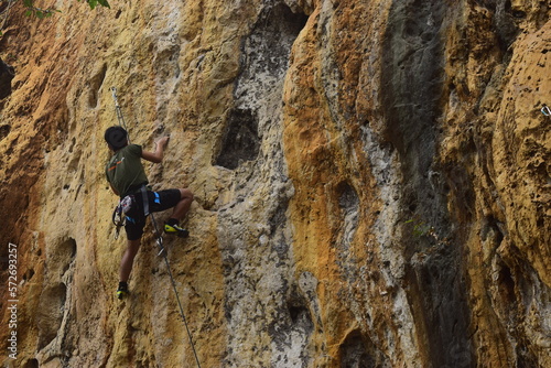 Rock climbing at Goa Pawon cliff in Bandung, West Java, Indonesia
