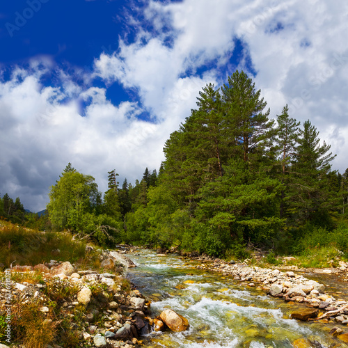 river rushing through the mountain valley, natural travel landscape photo