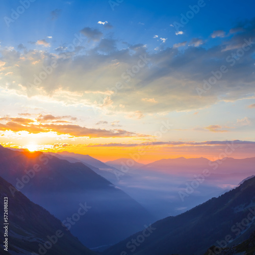 mountain walley in dense blue mist at the sunrise  early morning mountain landscape